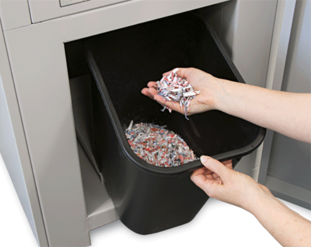 Shredded cards, dice and chips land in the rugged waste bin for easy disposal