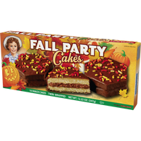 Left-angle view of Little Debbie Chocolate Fall Party Cakes with fudge icing and autumn sprinkles