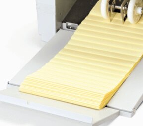 This paper folder has an extended exit tray that ensures the neat stacking of finished folded papers.