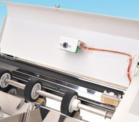 This is an image of the paper folder's double feed detection system. This sensor prevents mis-folded papers from being contaminated to outputs.