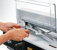 Blade changes can be made without removing the blade covers. The handy blade changing device covers the cutting edge of the blade. This ensures safe blade changes consistently occur.