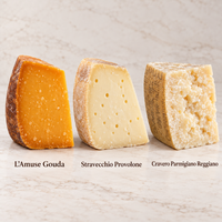 L’Amuse Gouda, Stravecchio Provolone, and Cravero Parmigiano Reggiano displayed as three cheese selections