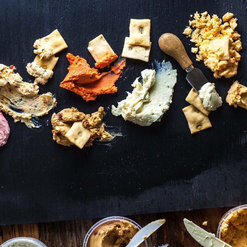 Cheese spreads and crackers arranged for serving