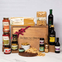 Di Bruno Bros. Italian Kitchen gift crate displayed with pasta, sauces, oils and antipasti