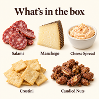 Five Taste of Di Bruno gift box components: salami, Manchego, cheese spread, crostini, and candied nuts