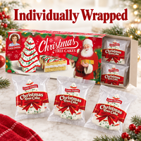 Open Little Debbie Christmas Tree Cakes box with five individually wrapped vanilla tree cakes.