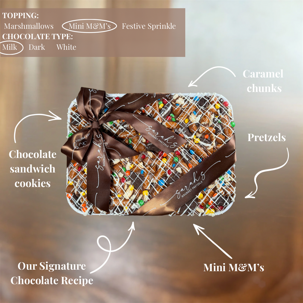 Custom chocolate bark platter with pretzels, caramel, chocolate cookies, candy pieces and decorative drizzle