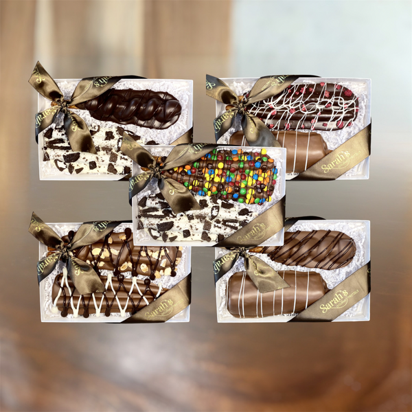 Five Sarah’s Gourmet Pretzels gift boxes containing ten assorted chocolate-covered pretzel rods