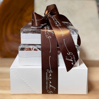 Side view of Sarah’s Gluten-Free Gift Tower showing stacked gift boxes and Sarah’s Gourmet Pretzels ribbon