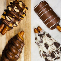 Gluten-free chocolate pretzel rods with turtle, caramel, peanut butter and cookies-and-cream toppings