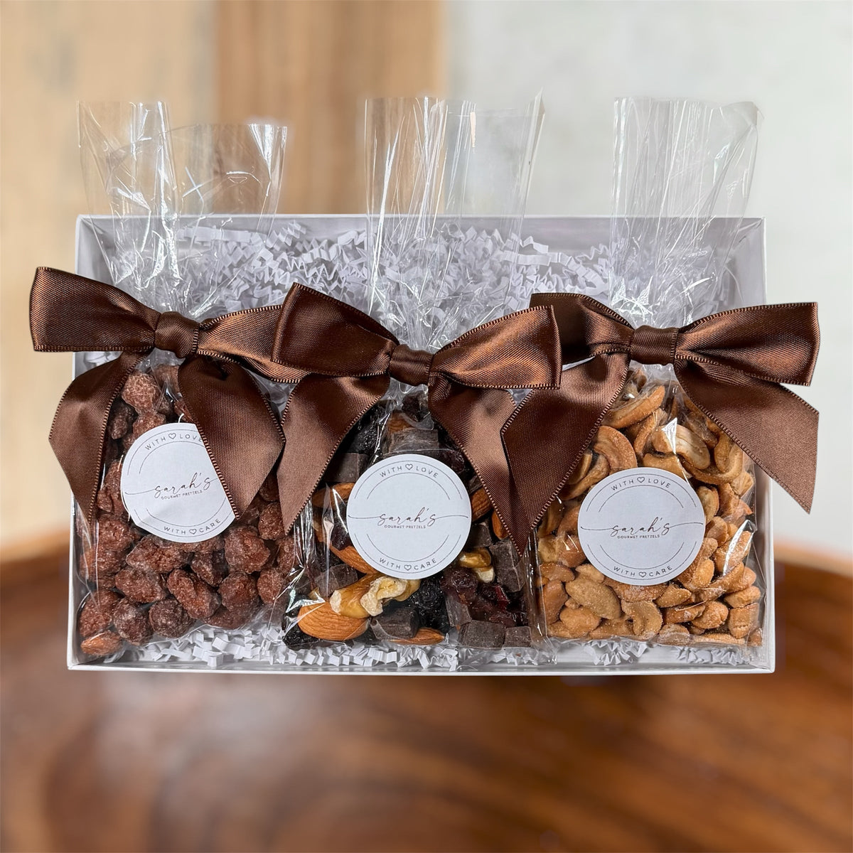 Sarah’s gourmet trail mix, vanilla roasted cinnamon almonds and cashews in a clear gift box