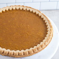 Close view of a smooth pie filling and crimped crust
