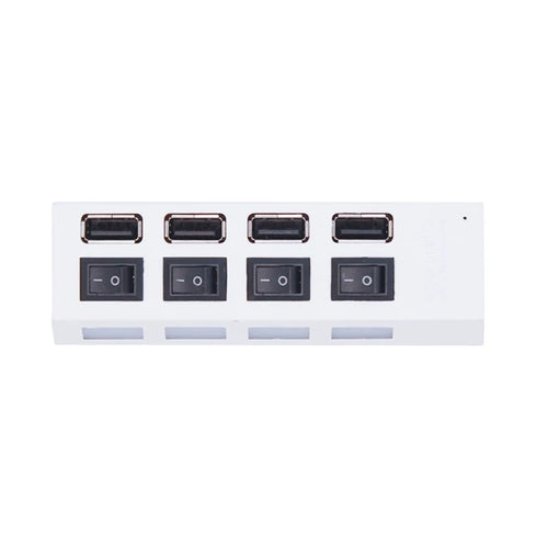 Top view of white four-port USB-A hub with individual switches