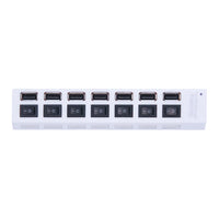 Top view of white seven-port USB-A hub with individual switches