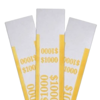 Yellow pre-sealed currency straps for a $1,000 stack of ten-dollar bills